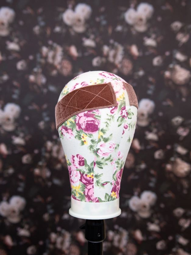 Floral-patterned headband on a black background with floral designs
