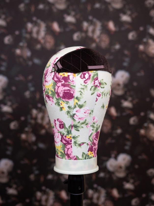 Floral-patterned headband on a dark floral background