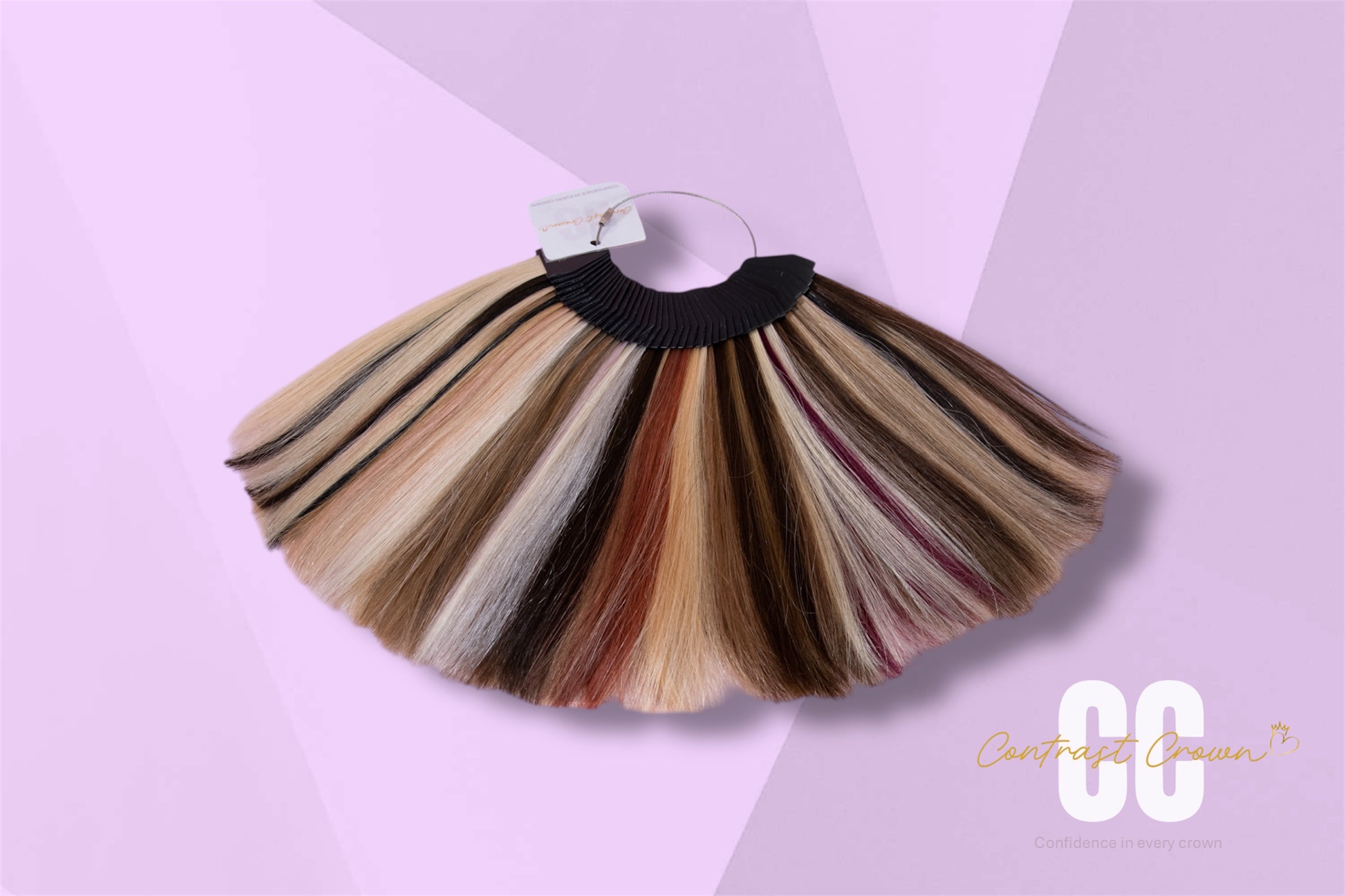 Hair color swatch with multiple shades on a pink background